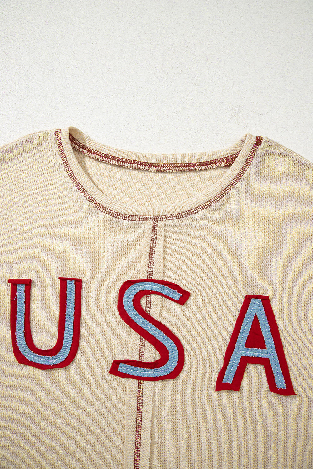 exposed seam long sleeve top