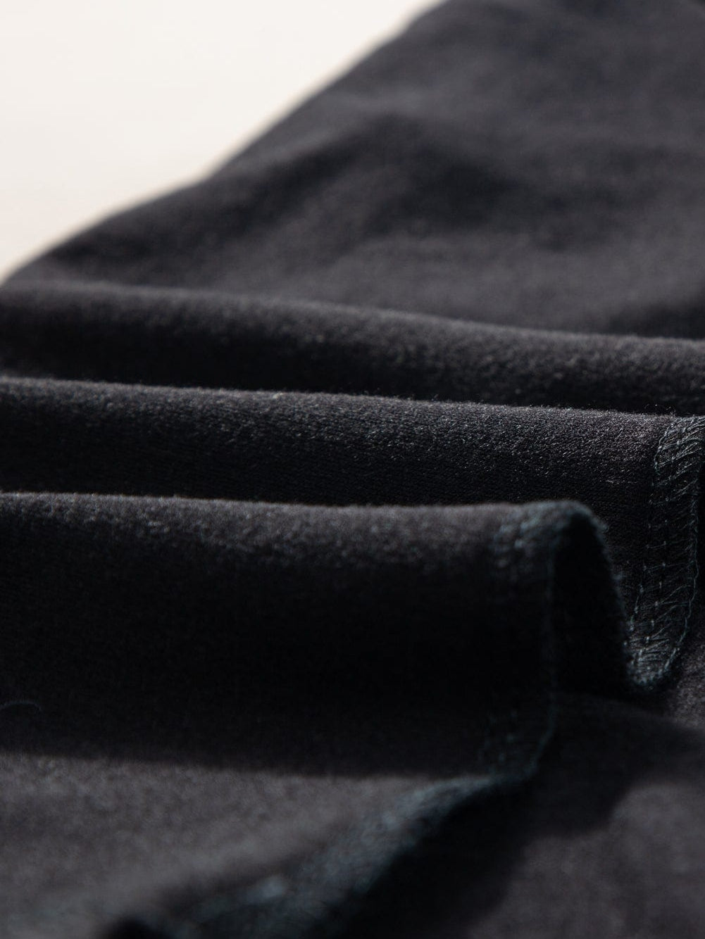 Black V Neck Pocketed Tee with Curved Hem