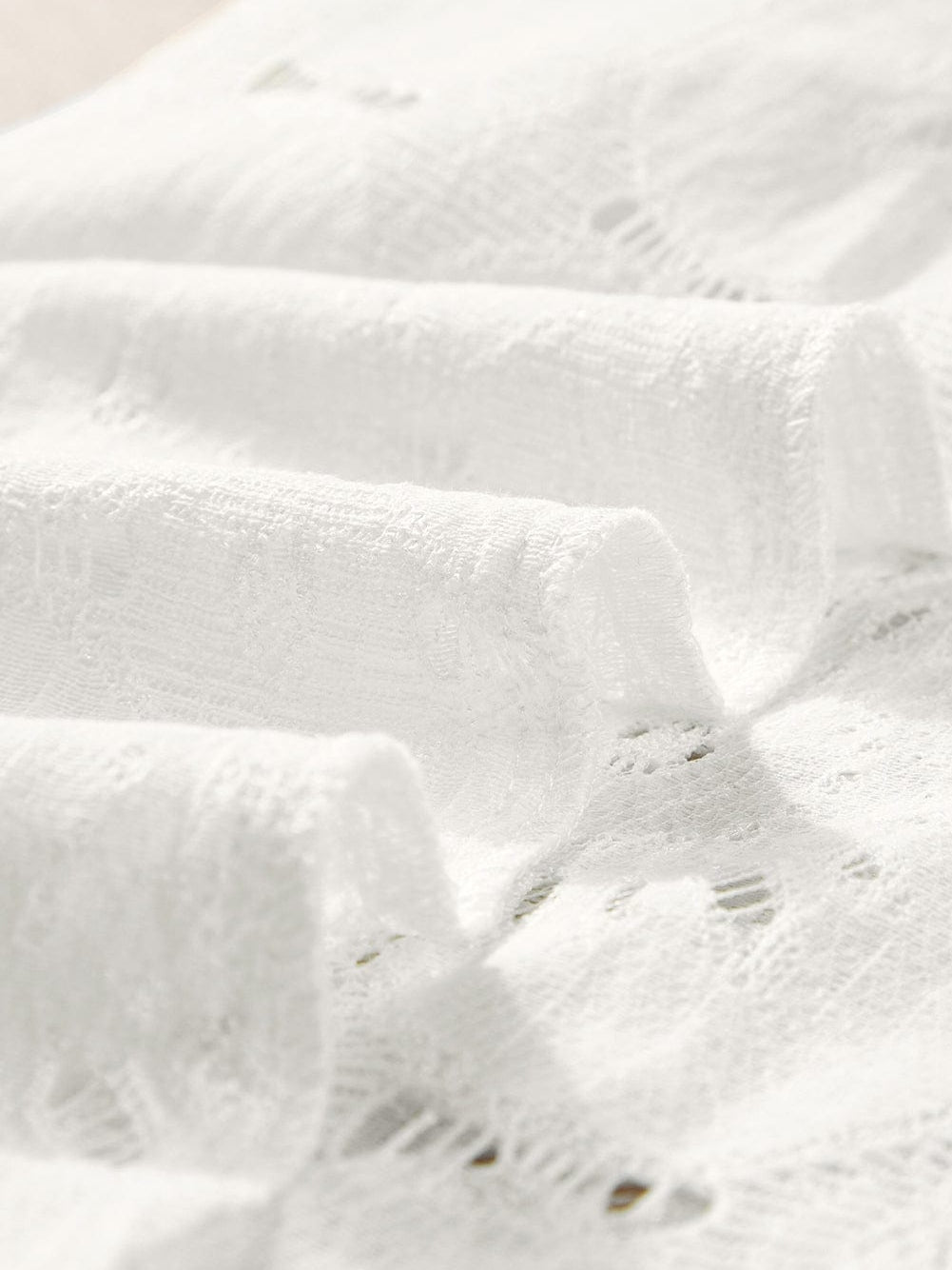 Elegant White Floral Eyelet Keyhole Top with Ruffle Detail