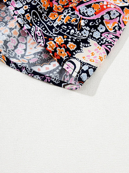 Graceful Black Floral Peplum Sweater with Ruffled Hem