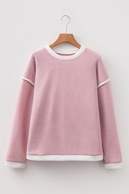 light pink knit top