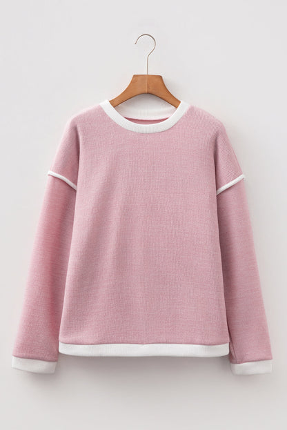 light pink knit top