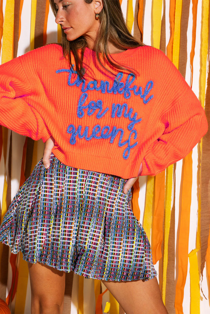 orange graphic sweater