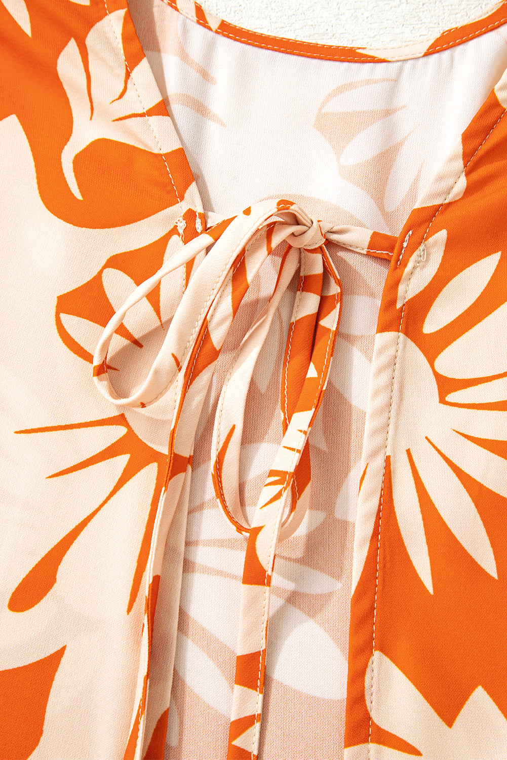 orange floral blouse