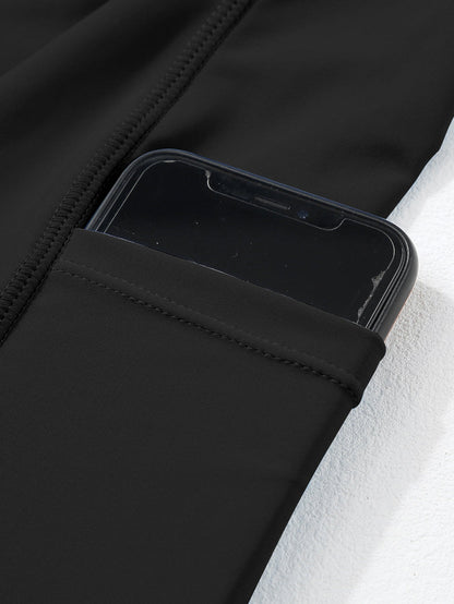 Sporty Black Ribbed Spaghetti Straps Swimdress with Flared Silhouette