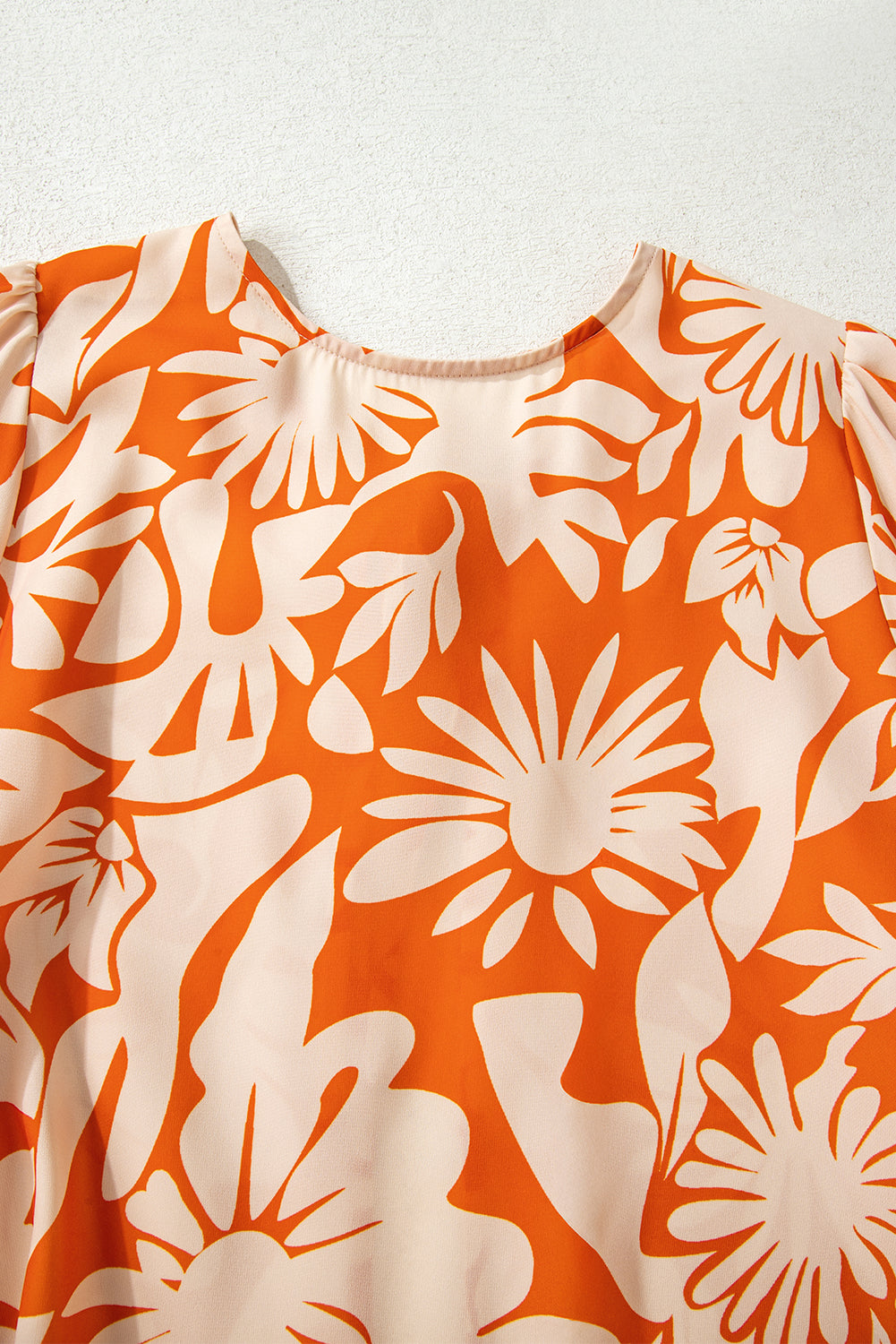 orange floral blouse