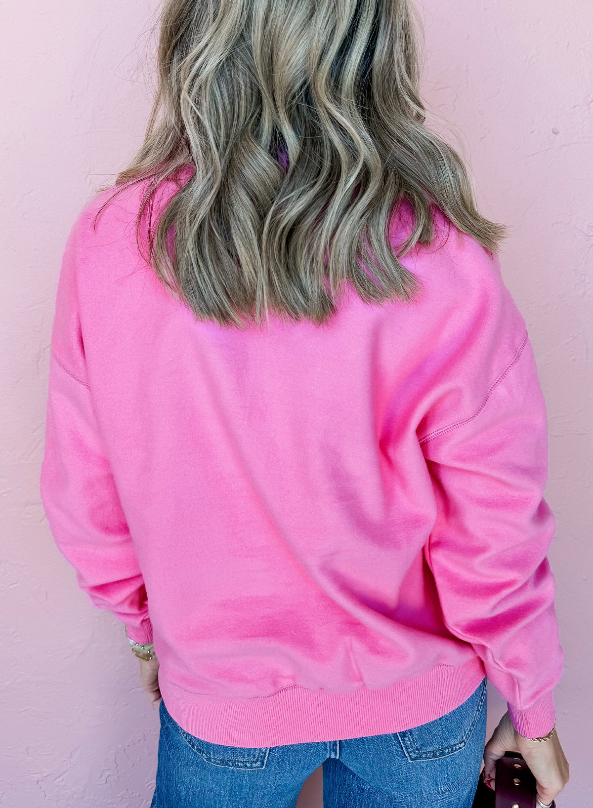 bright pink sweatshirt