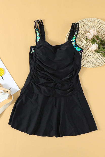 Floral Print Black Swimdress with Adjustable Straps and Ruched Panel