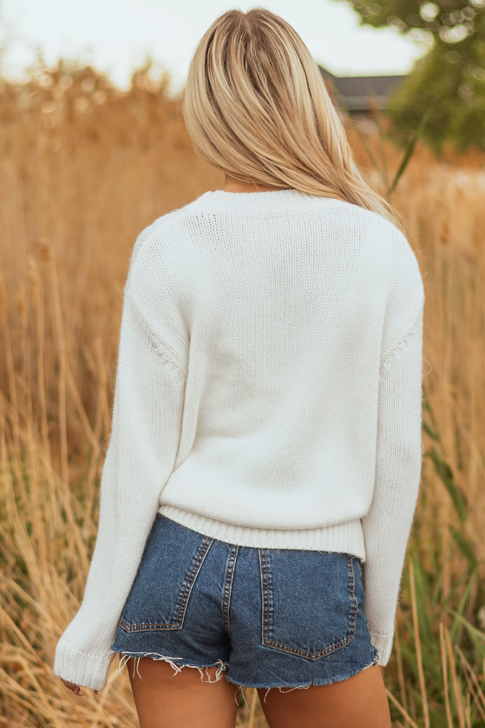 white embroidered sweater