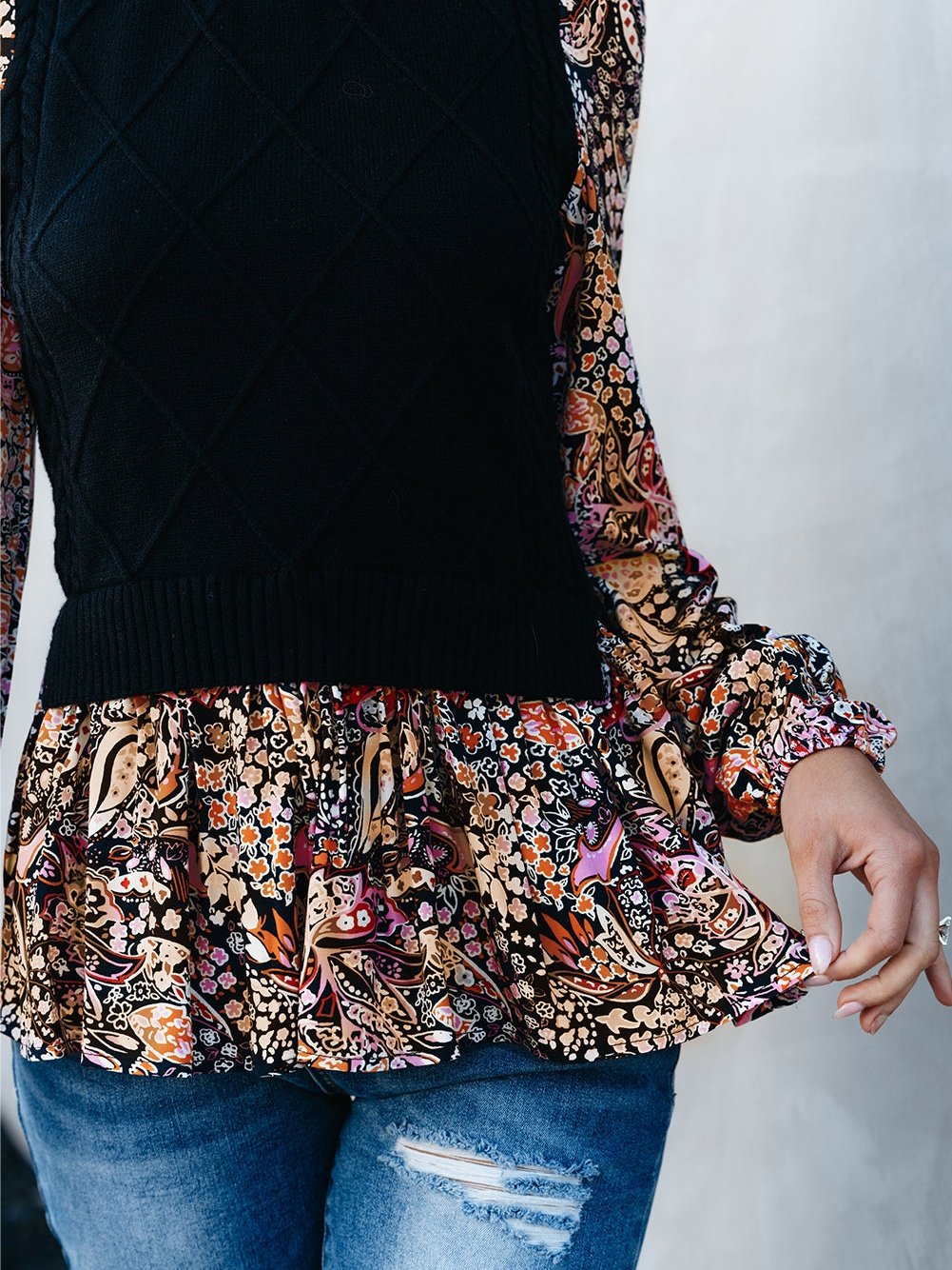 Graceful Black Floral Peplum Sweater with Ruffled Hem