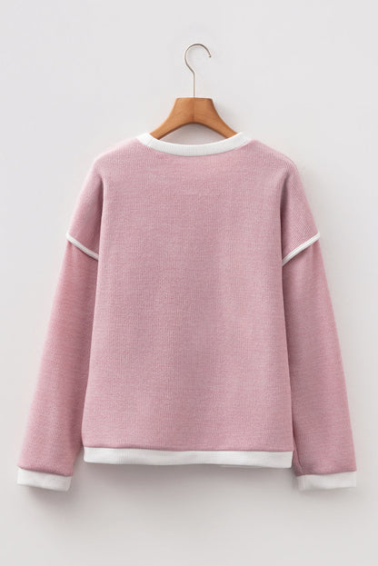 light pink knit top