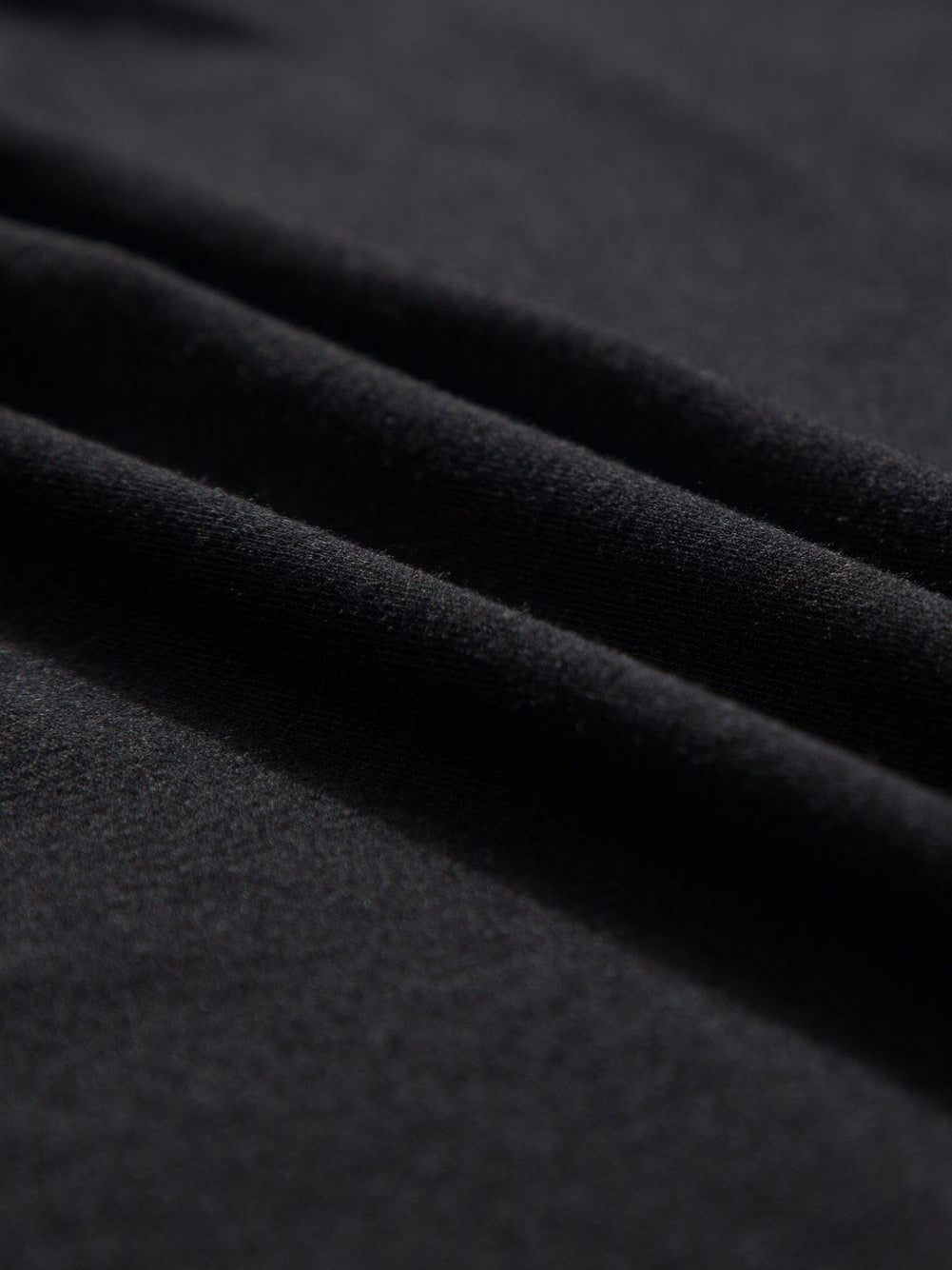 Black V Neck Pocketed Tee with Curved Hem