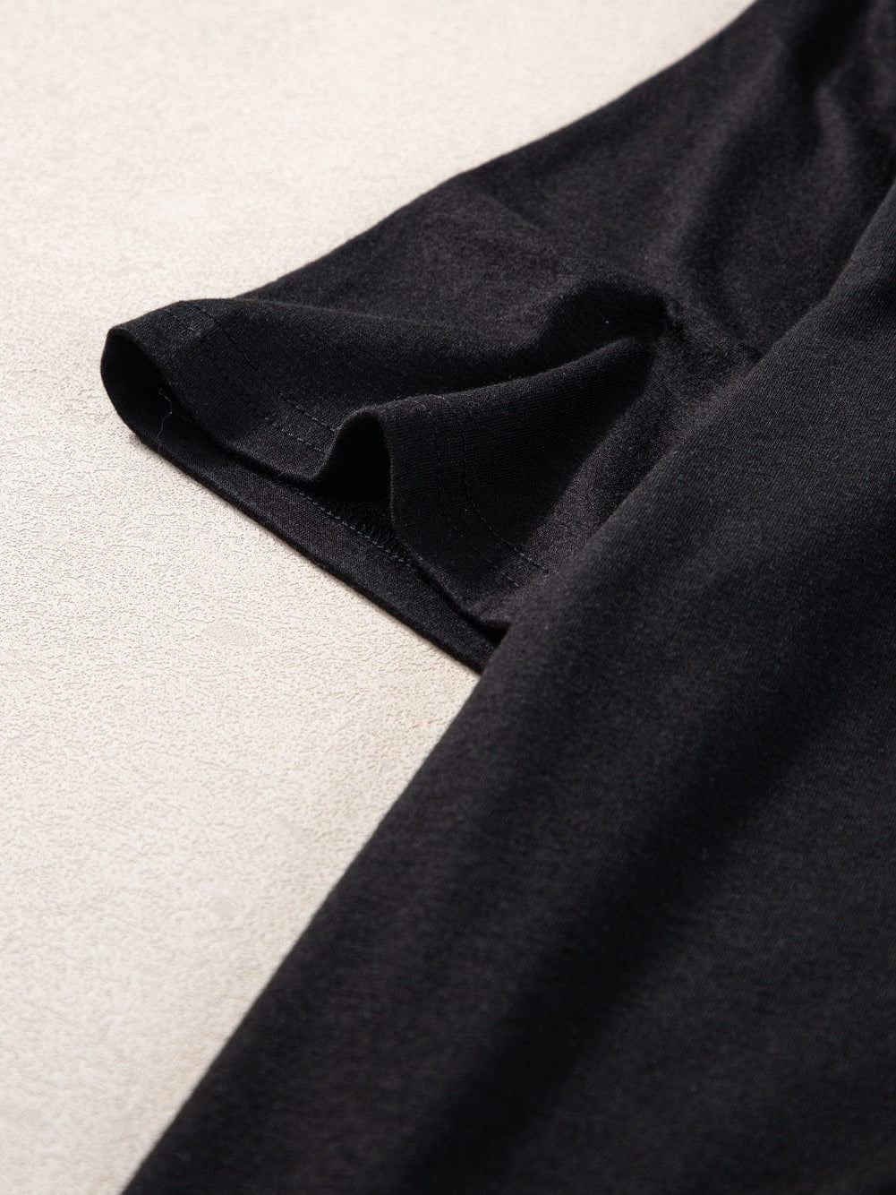 Black V Neck Pocketed Tee with Curved Hem