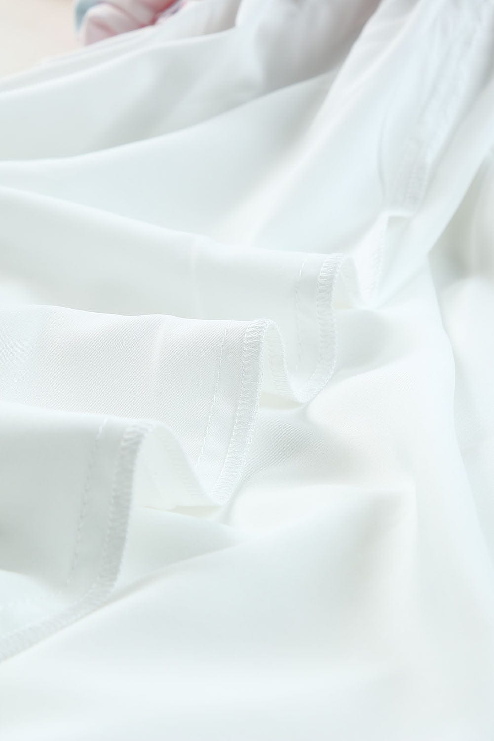 Boho Chic Smocked Mini Dress with Geometric Print and Puff Sleeves