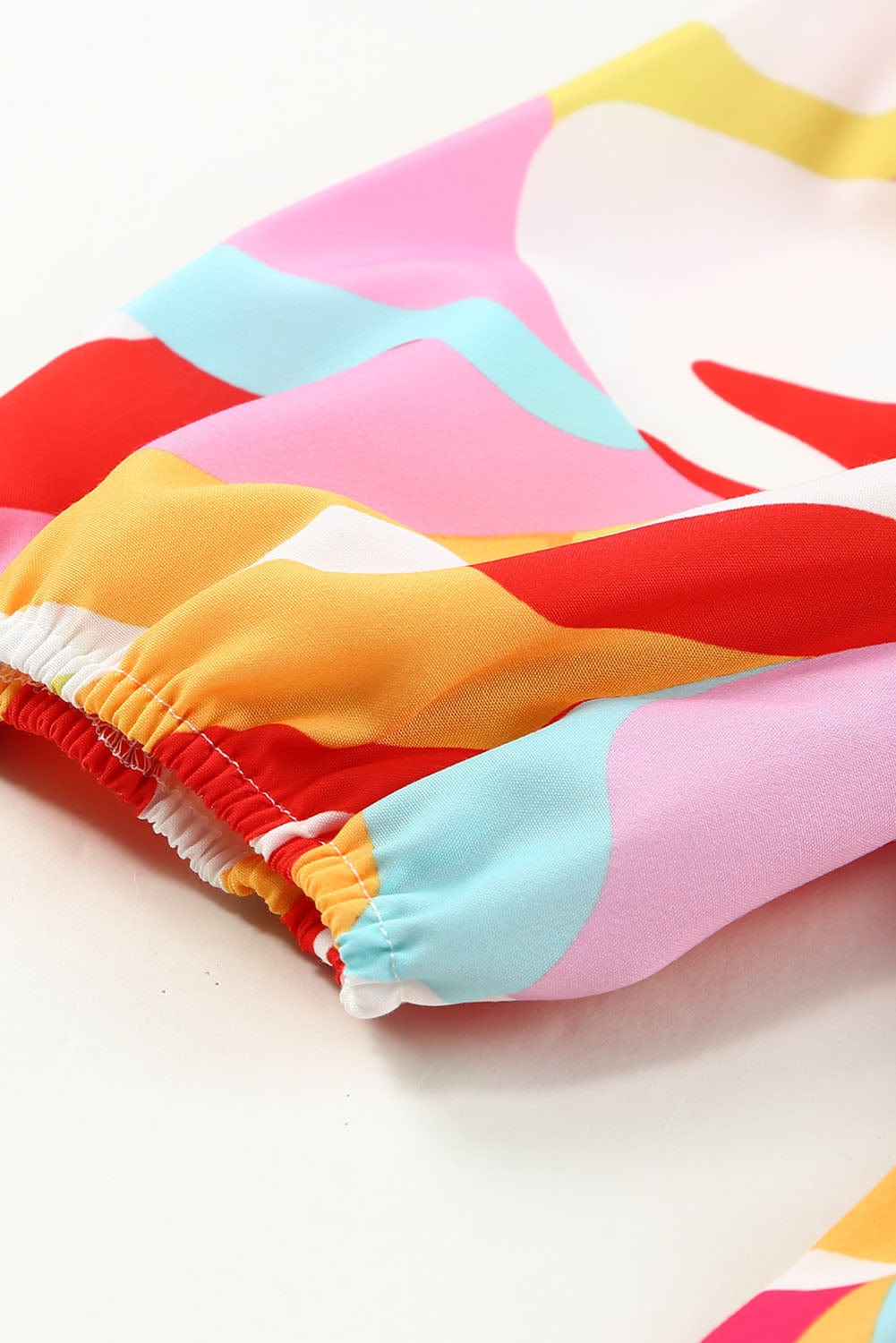 Boho Chic Smocked Mini Dress with Geometric Print and Puff Sleeves