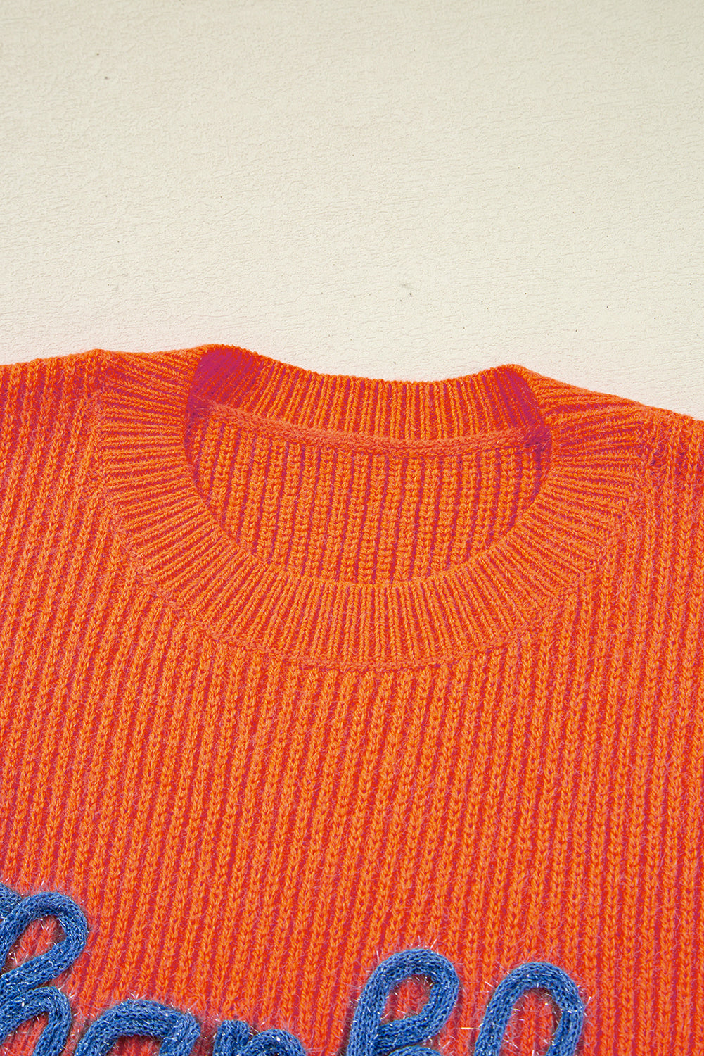 orange graphic sweater