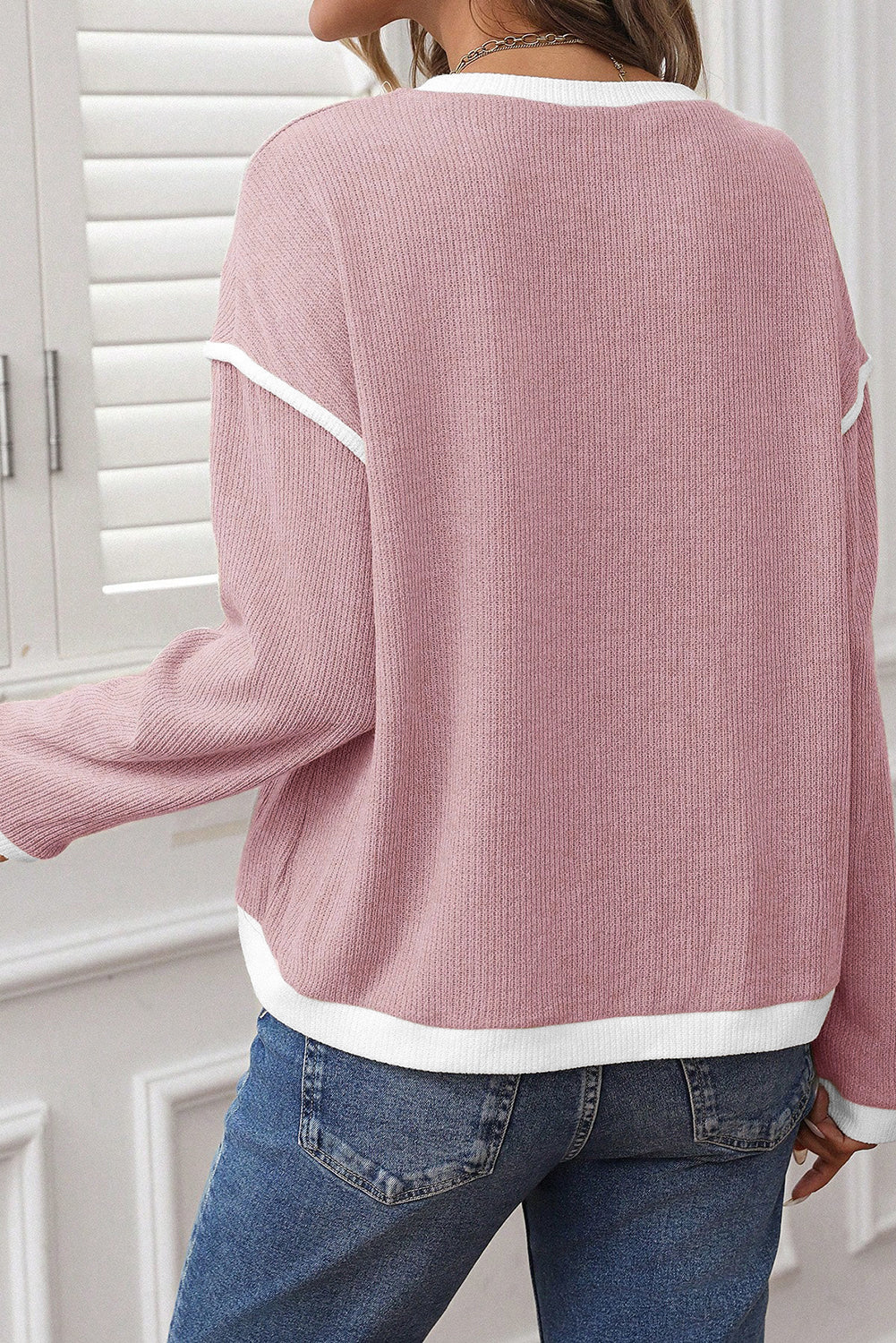 light pink knit top