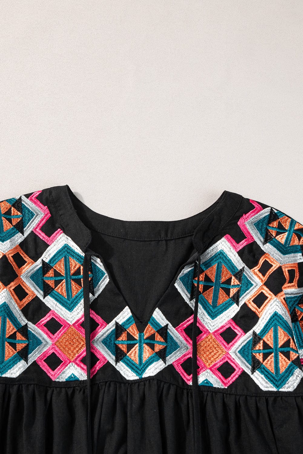Chic Black Geometric Embroidered Tassel Blouse with V-Neck Tie