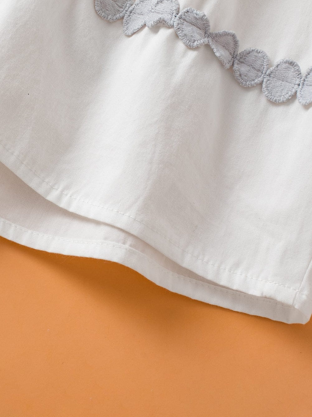 Chic White Peplum Tank Top with Ricrac Detail