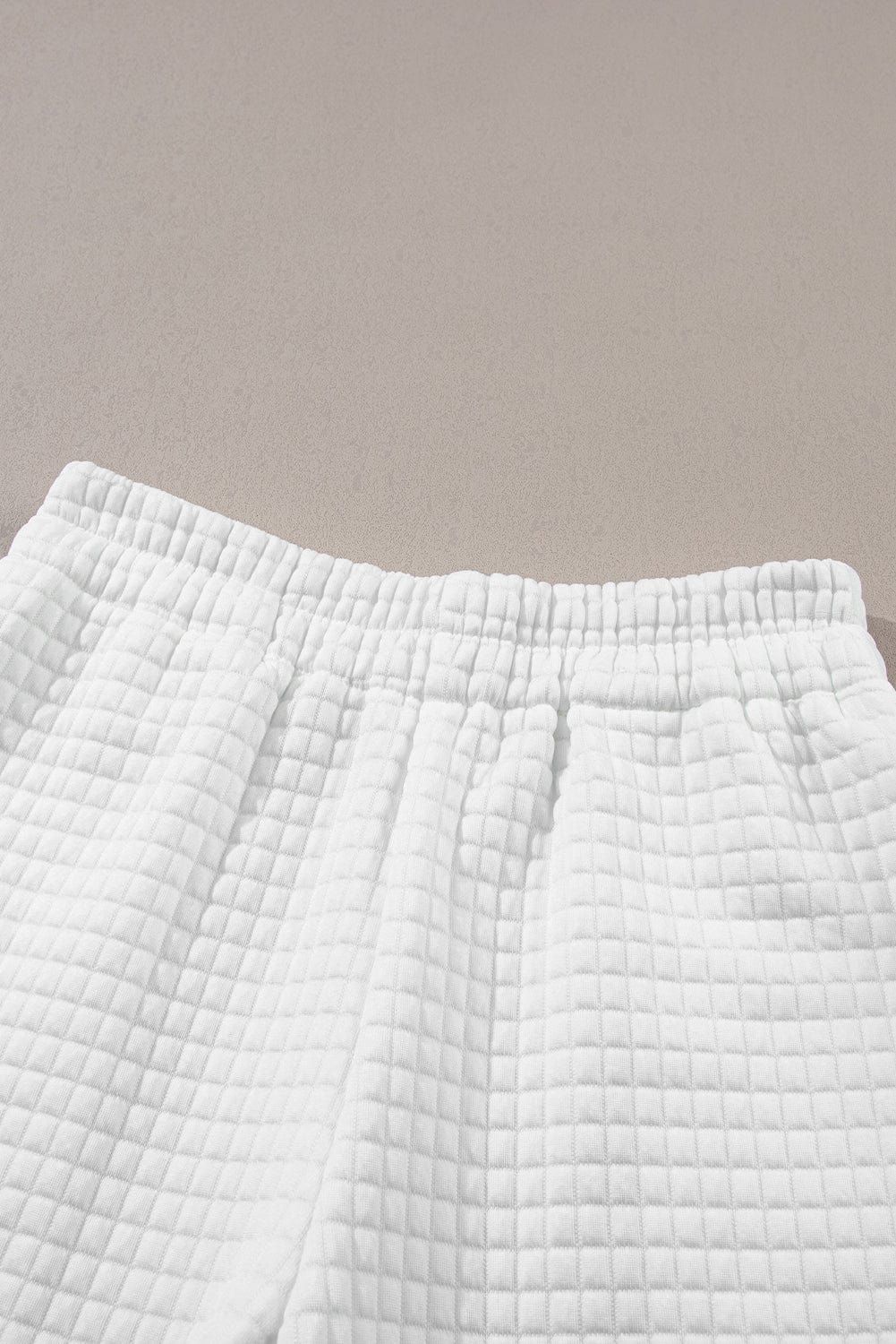 Chic White Textured Lattice Crop Top and Jogger Pants Ensemble