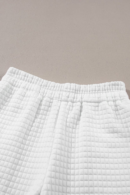 Chic White Textured Lattice Crop Top and Jogger Pants Ensemble