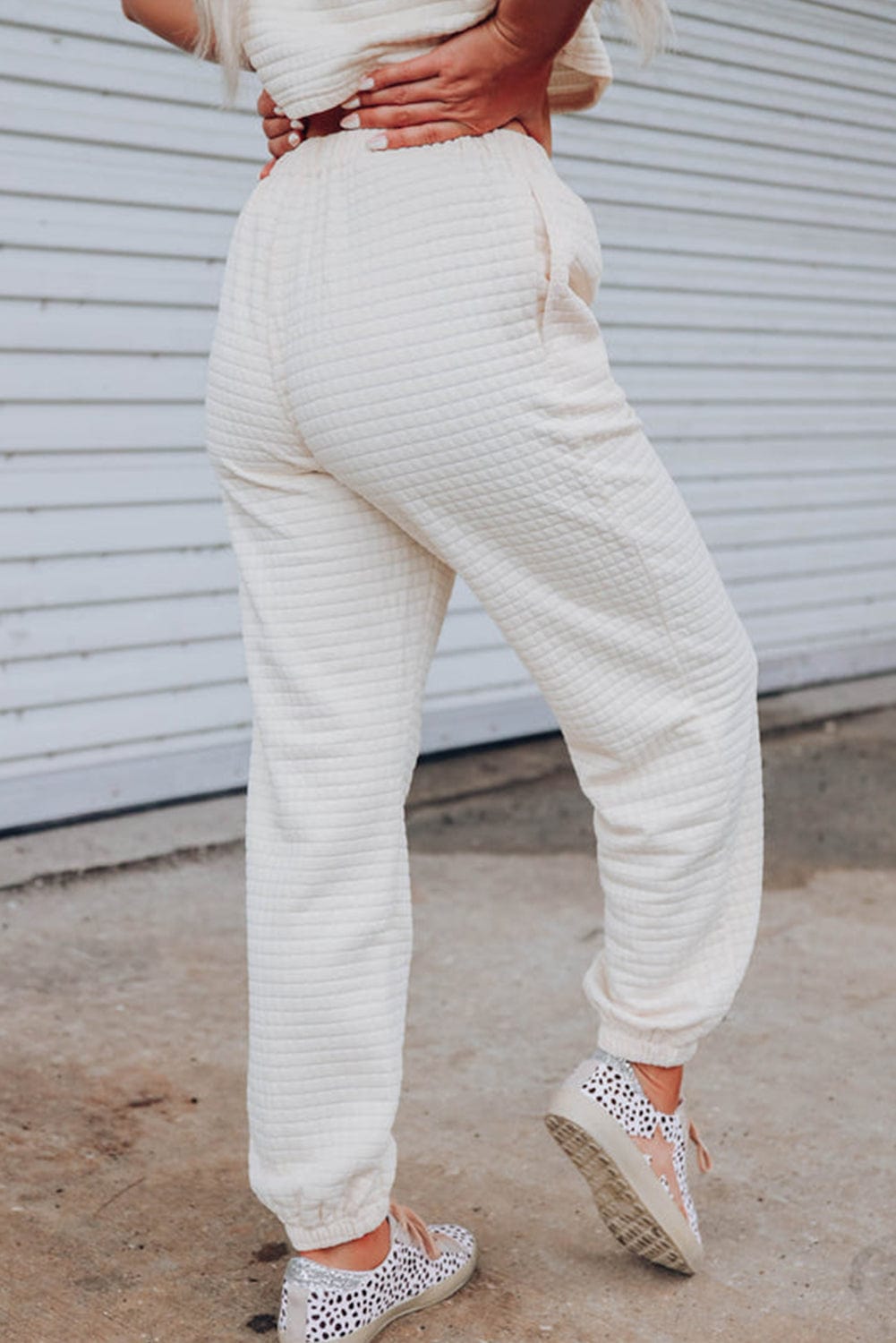 Chic White Textured Lattice Crop Top and Jogger Pants Ensemble