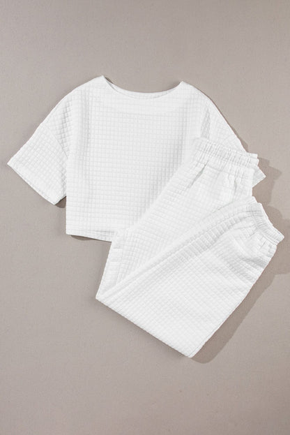Chic White Textured Lattice Crop Top and Jogger Pants Ensemble
