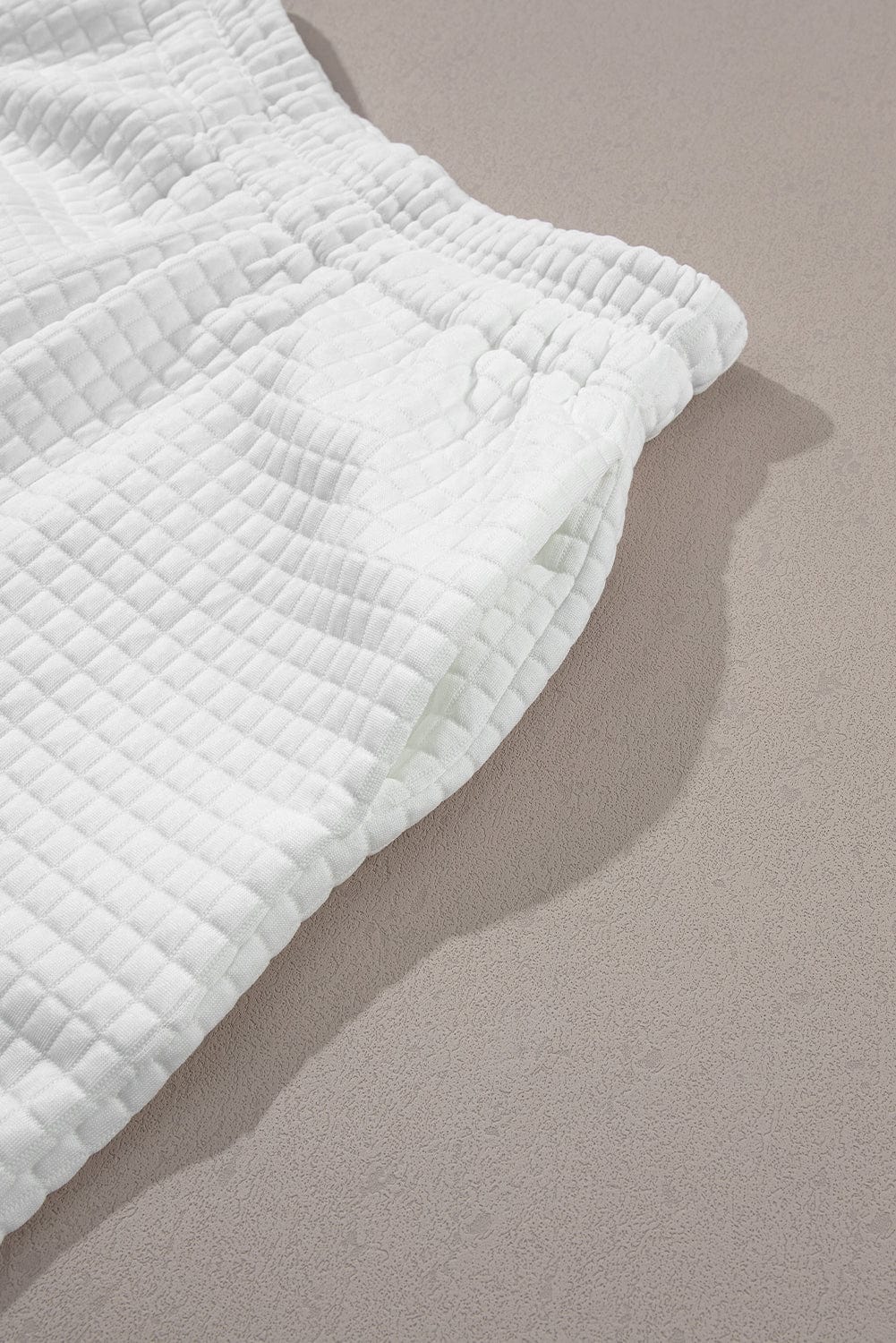 Chic White Textured Lattice Crop Top and Jogger Pants Ensemble