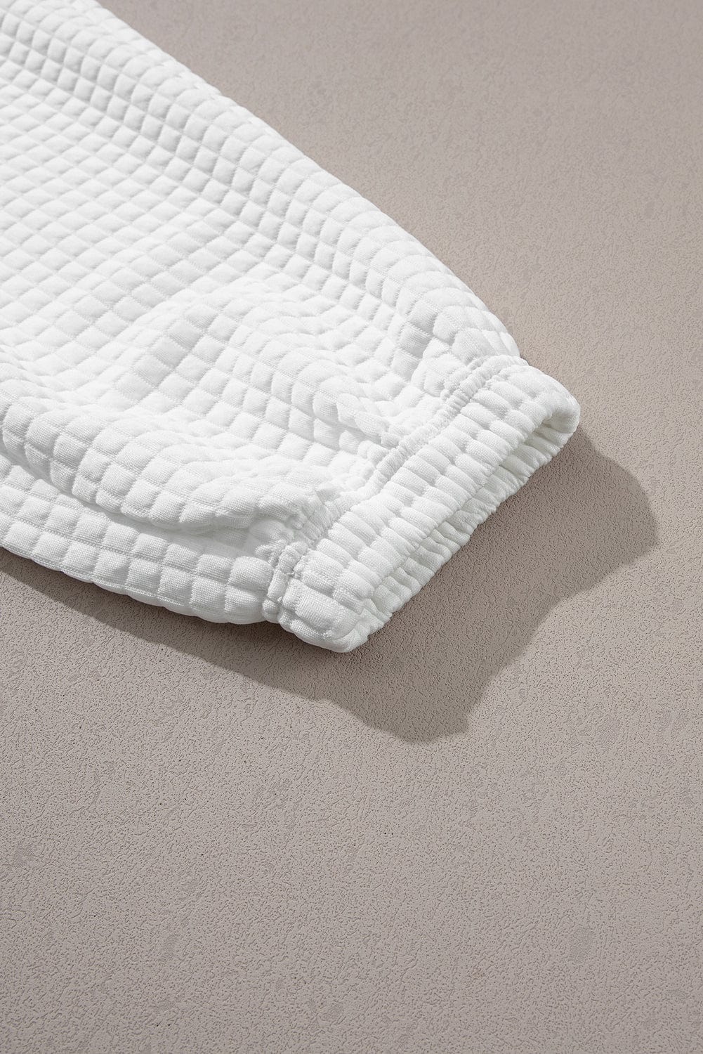 Chic White Textured Lattice Crop Top and Jogger Pants Ensemble