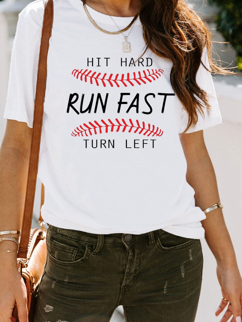 Baseball Print White Tee with "Hit Hard Run Fast Turn Left" Design