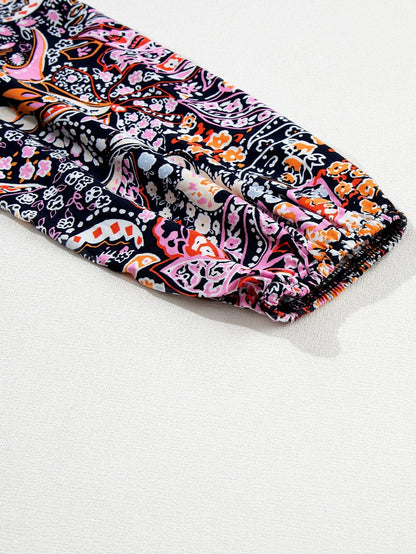 Graceful Black Floral Peplum Sweater with Ruffled Hem