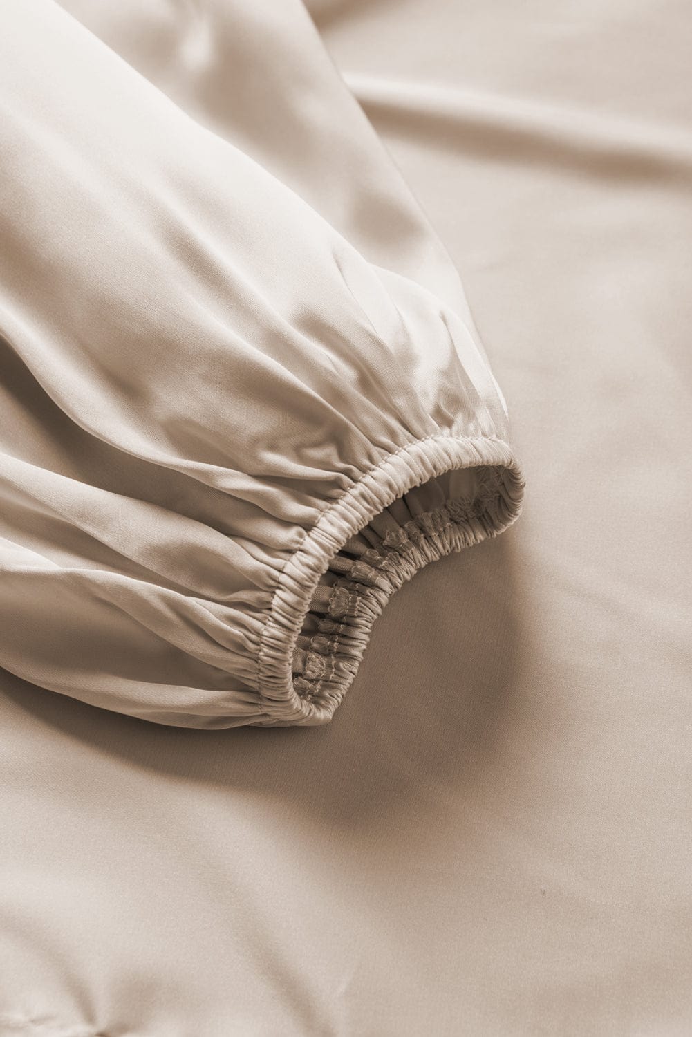 Elegant Apricot Satin Blouse with Asymmetrical Neck & Balloon Sleeves