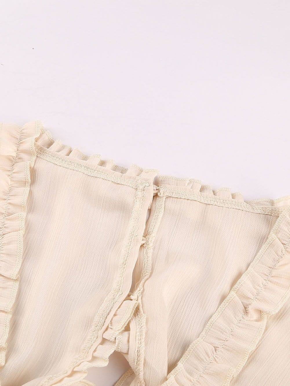 Elegant Beige Sheath Dress with V Neck Ruffle Detail and Open Back