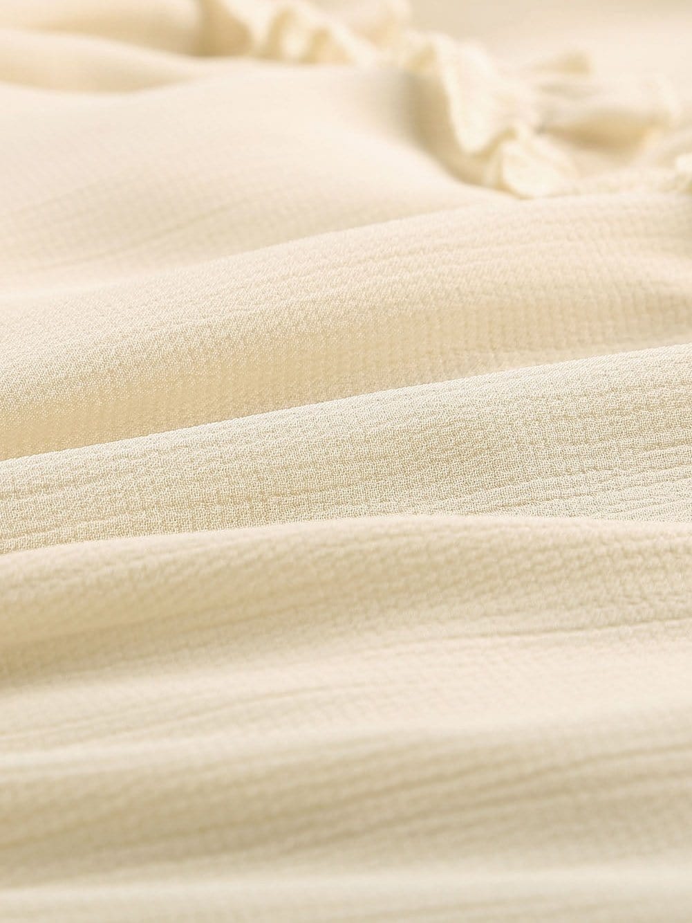 Elegant Beige Sheath Dress with V Neck Ruffle Detail and Open Back