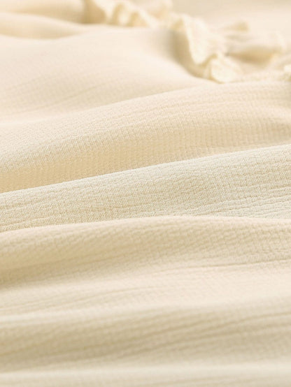 Elegant Beige Sheath Dress with V Neck Ruffle Detail and Open Back