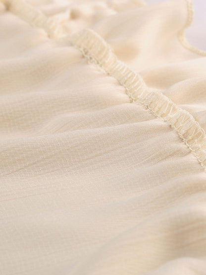 Elegant Beige Sheath Dress with V Neck Ruffle Detail and Open Back