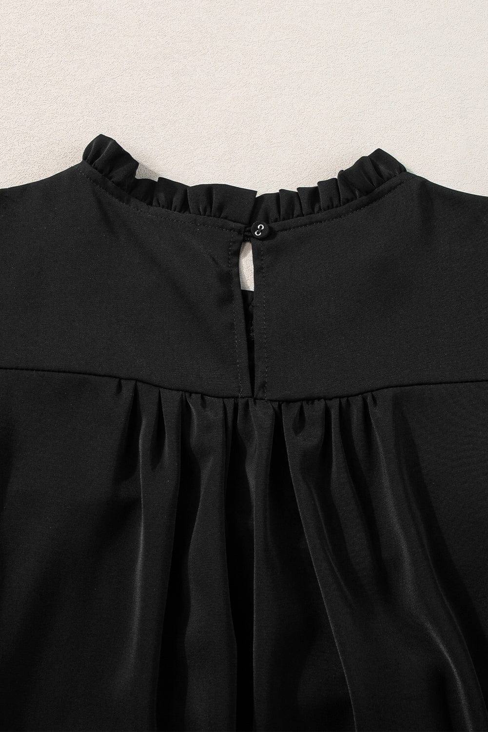 Elegant Black Smocked Blouse with Ruffle Sleeves