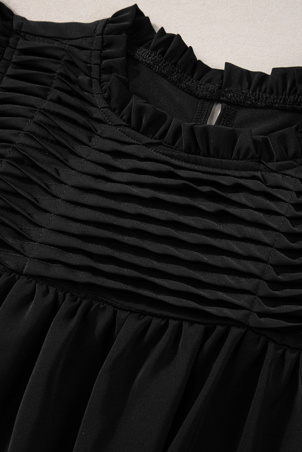 Elegant Black Smocked Blouse with Ruffle Sleeves