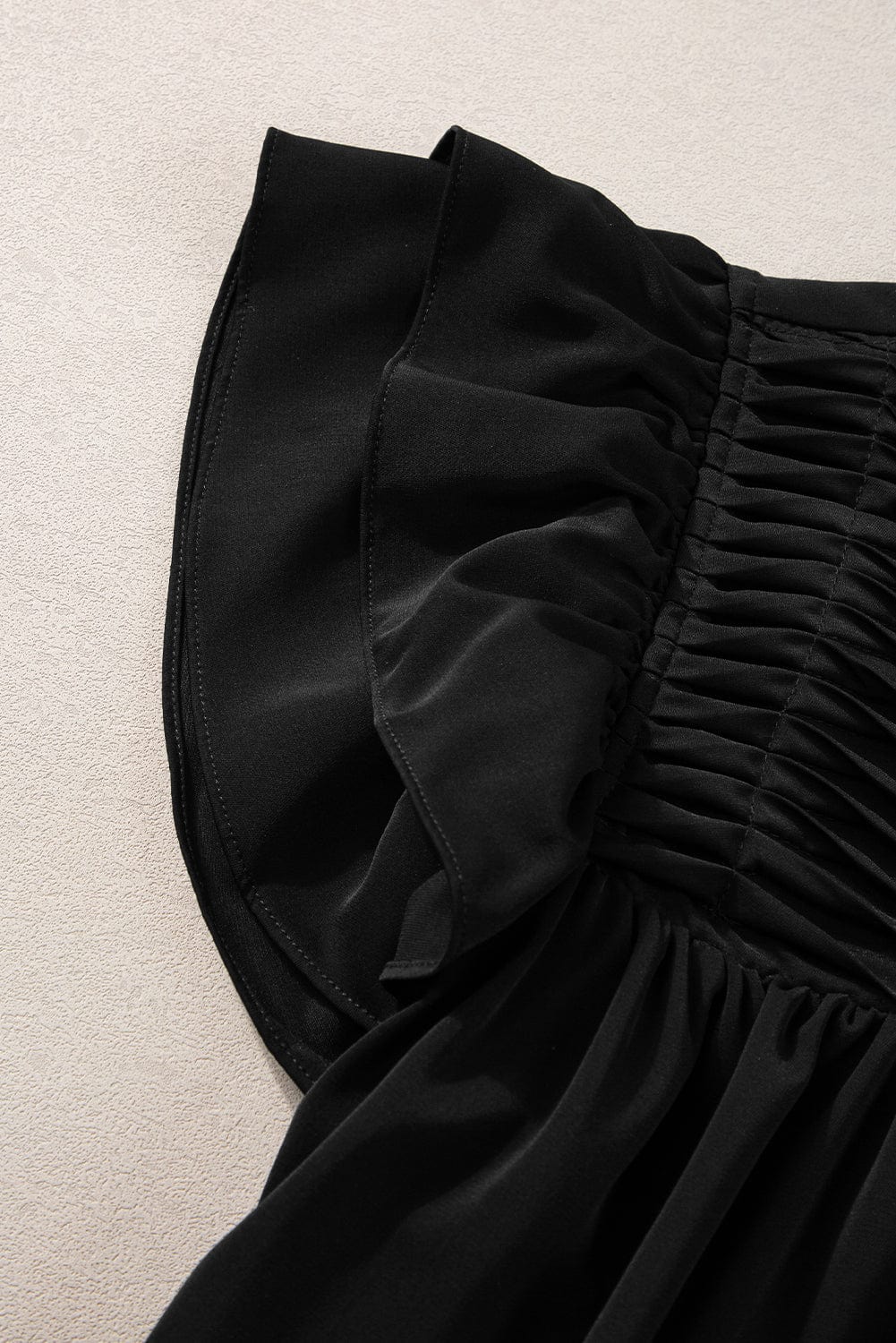 Elegant Black Smocked Blouse with Ruffle Sleeves