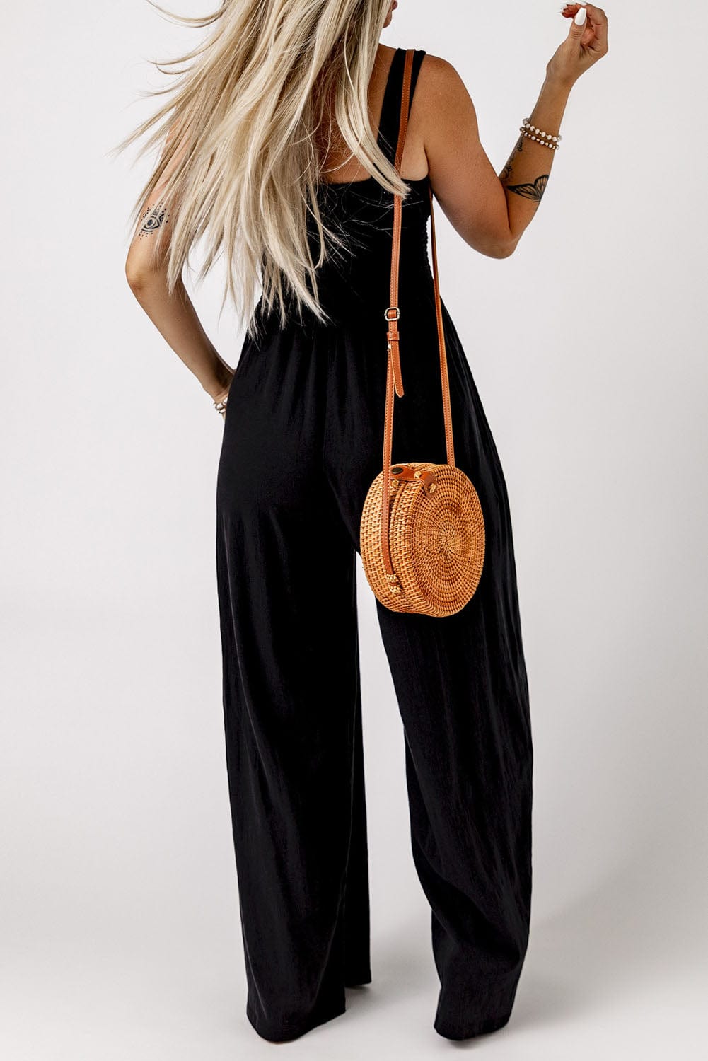 Elegant Black Smocked Sleeveless Jumpsuit with Wide Leg and Chic Details