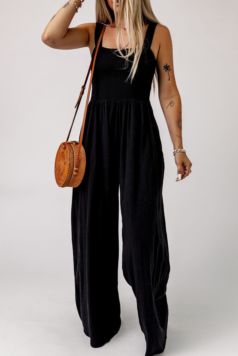Elegant Black Smocked Sleeveless Jumpsuit with Wide Leg and Chic Details