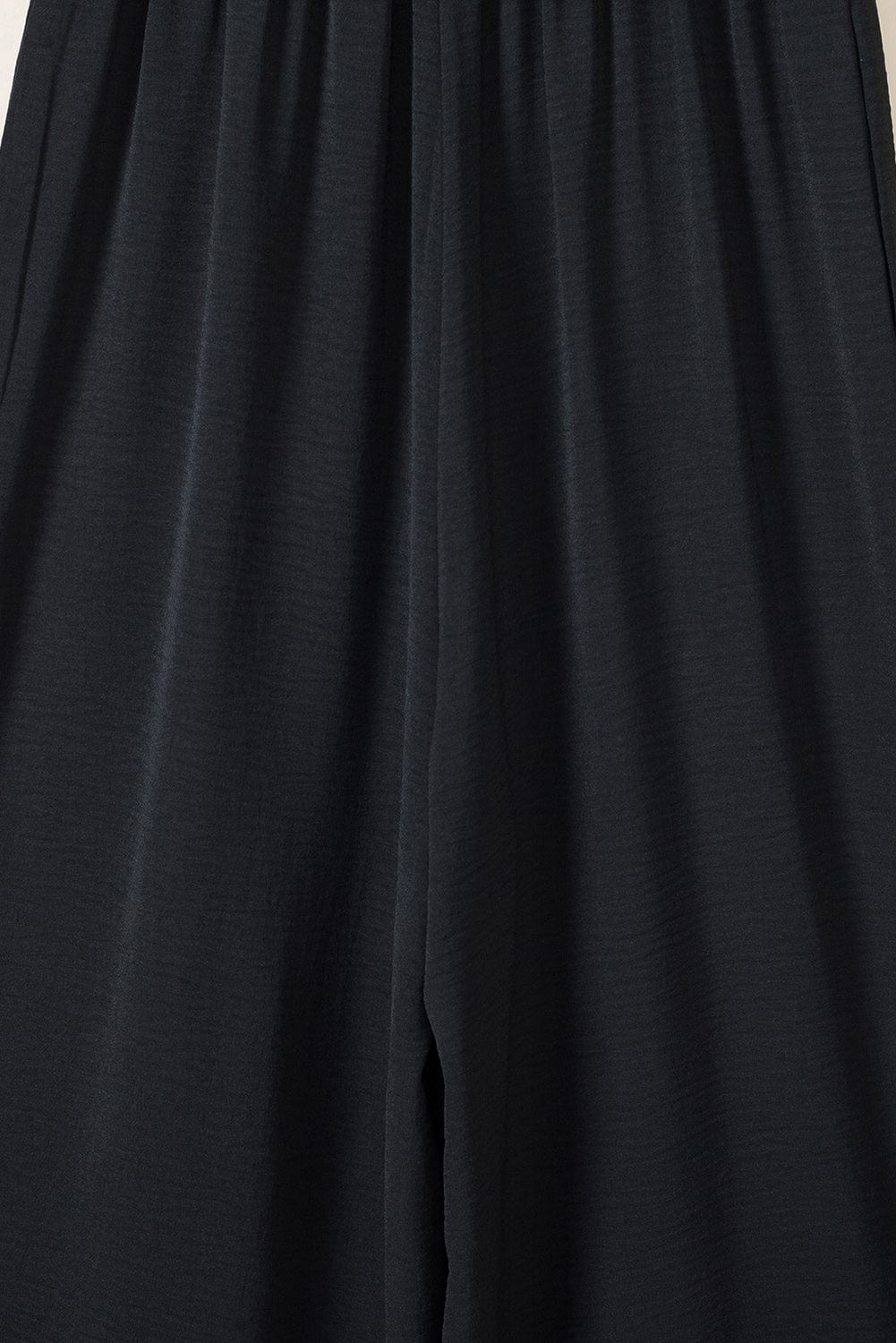 Elegant Black Smocked Sleeveless Jumpsuit with Wide Leg and Chic Details