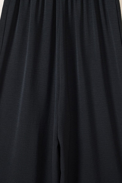 Elegant Black Smocked Sleeveless Jumpsuit with Wide Leg and Chic Details
