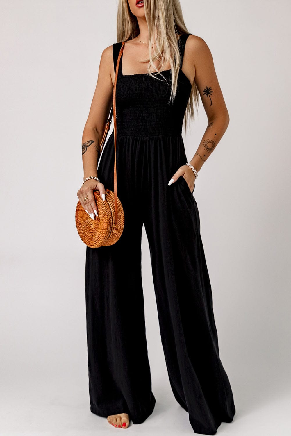 Elegant Black Smocked Sleeveless Jumpsuit with Wide Leg and Chic Details