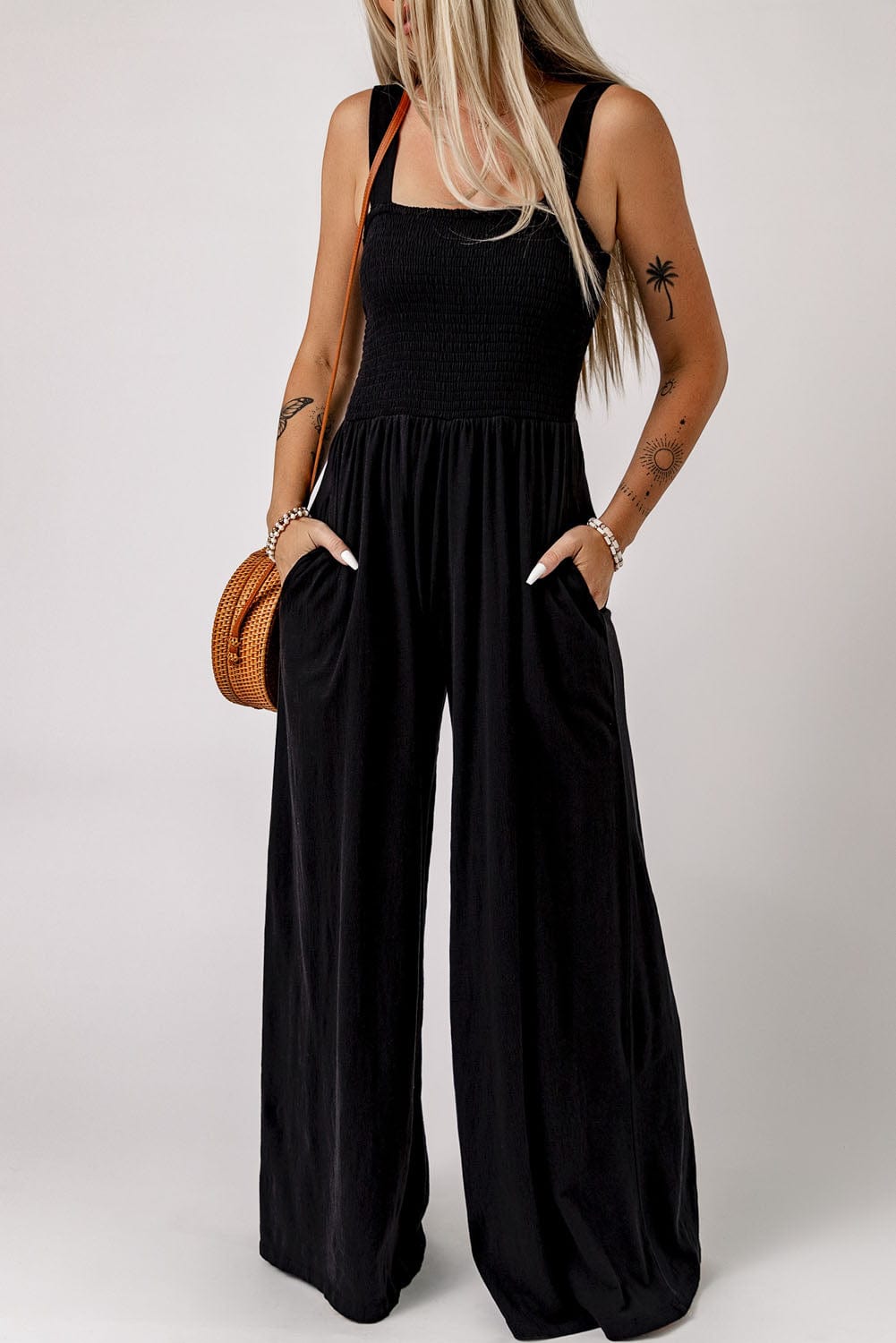 Elegant Black Smocked Sleeveless Jumpsuit with Wide Leg and Chic Details