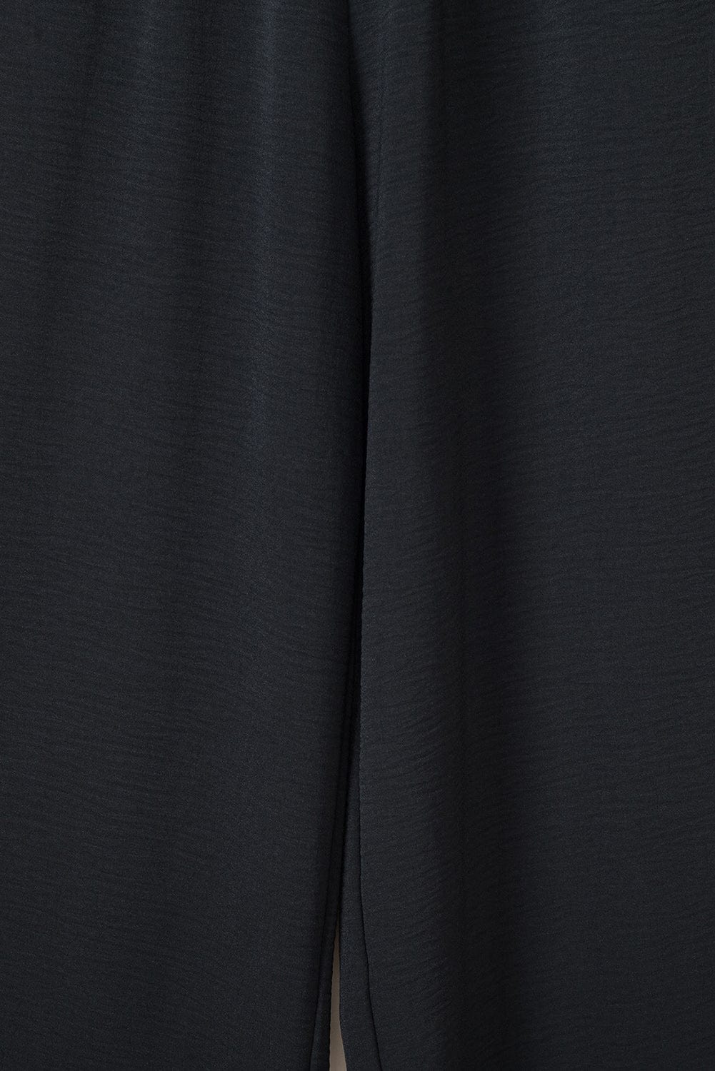 Elegant Black Smocked Sleeveless Jumpsuit with Wide Leg and Chic Details