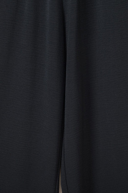 Elegant Black Smocked Sleeveless Jumpsuit with Wide Leg and Chic Details