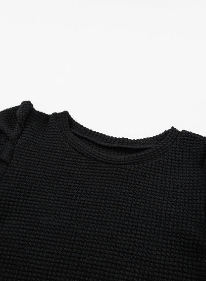 Elegant Black Waffle Knit Gigot Sleeve Top with Buttoned Cuffs