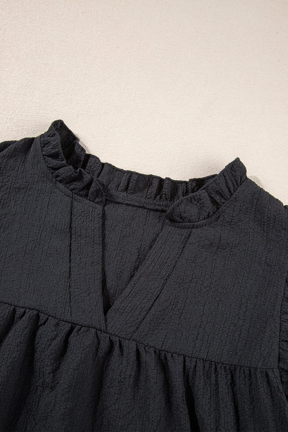 Elegant Black Waffle Knit Ruffle Flutter Top with Notch Neck