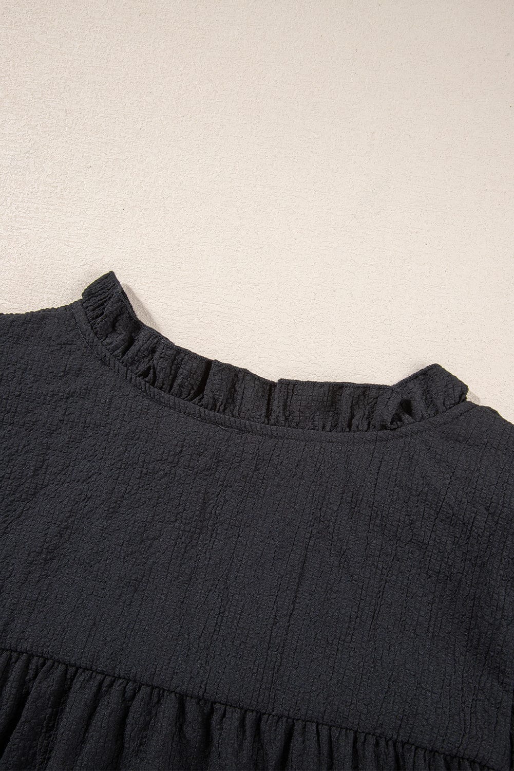 Elegant Black Waffle Knit Ruffle Flutter Top with Notch Neck